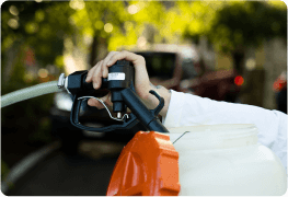 Close up view of a person filling up the tank of the pest control spray backpack.