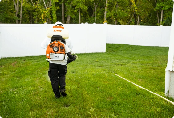 View from behind pest control person